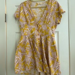 Lightweight, linen romper with true buttons throughout the torso. With pockets